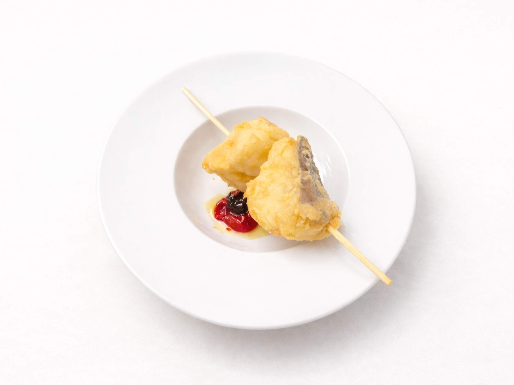 Spiedino di baccalà fritto servito al Ristorante Ulivi sul Mare di Cala Corvino